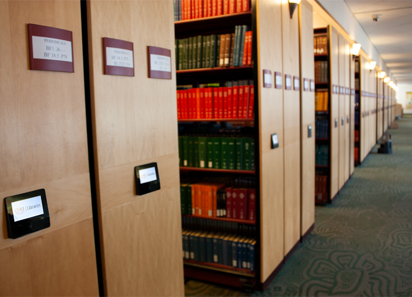 Figure 3. New controls being updated on 3rd floor shelves and looking down to the far end of the shelving