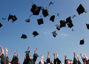 Graduation caps thrown into the air