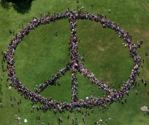 Humans forming peace sign.